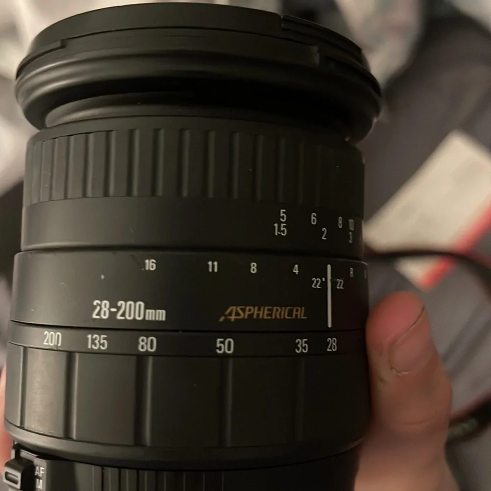 TOTAL CAMERA PACKAGE INCLUDES CANON T3 REBEL CAMERA, TELEPHOTO LENSE AND BAG